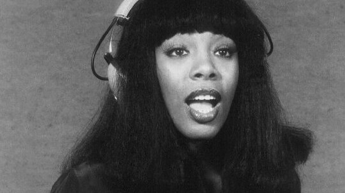 Donna Summer singing in a recording studio wearing headphones, September 1977