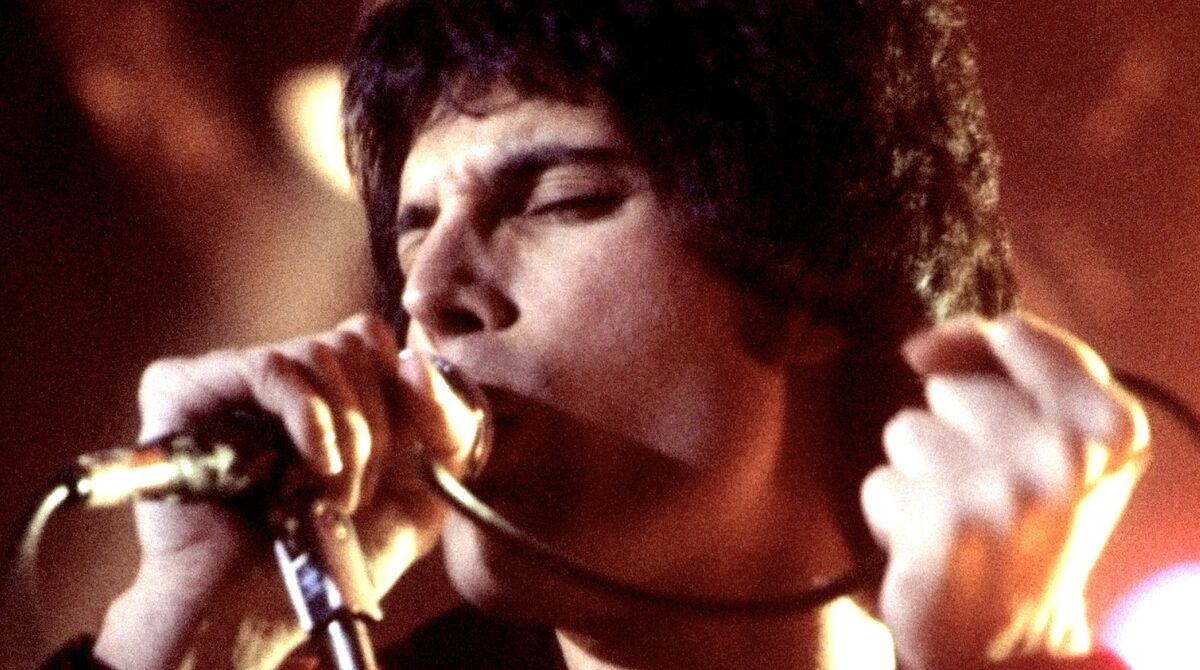 Freddie Mercury performing live in November 1977, the year Queen released We Will Rock You
