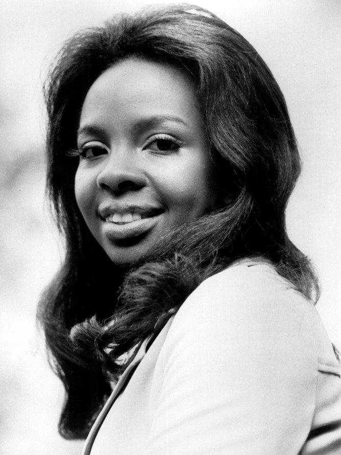 Black and white 1974 CBS Television publicity photo of Gladys Knight, who sang Midnight Train to Georgia with the Pips, smiling in a dark top