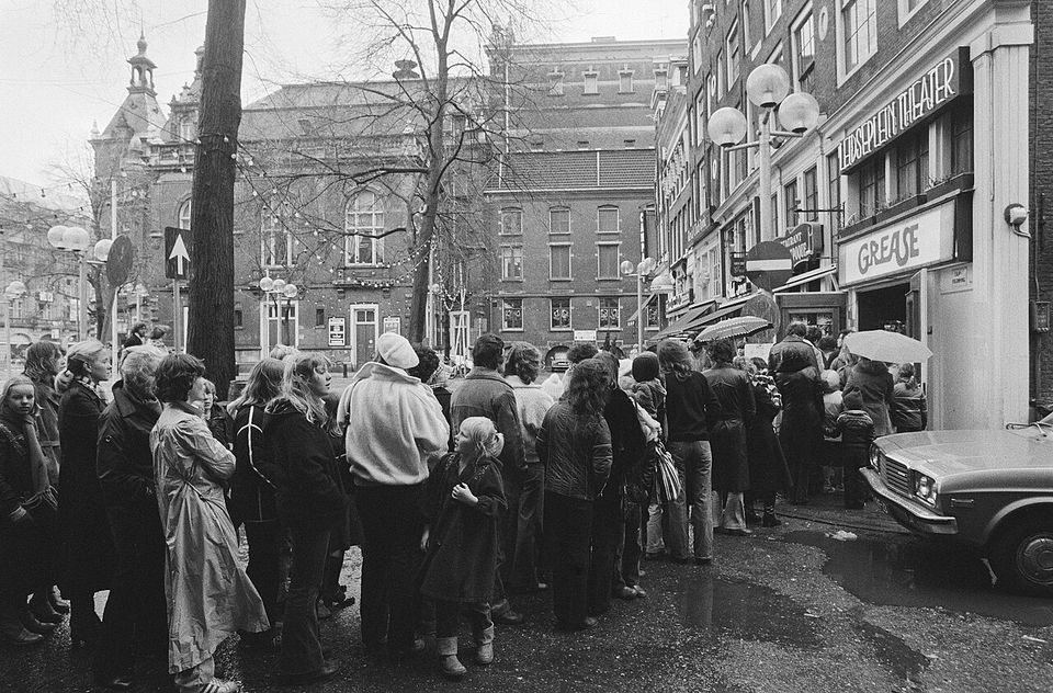 A long line of people waiting outside an Amsterdam cinema in December 1978 to see Grease, the film that made You're the One That I Want a global hit