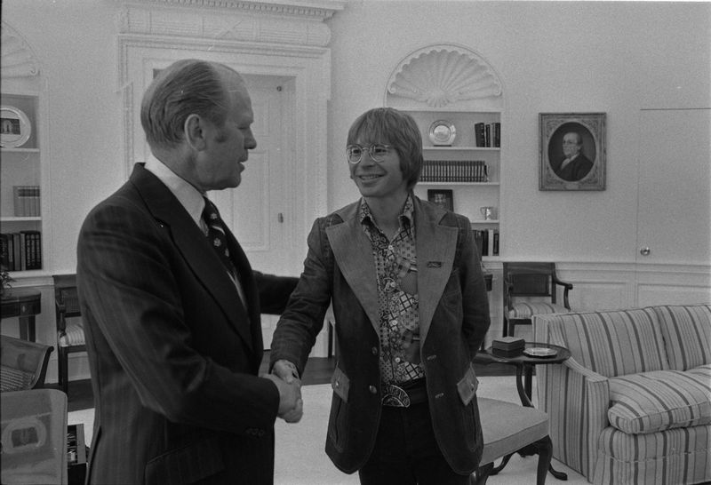 President Gerald R. Ford shaking hands with John Denver in the Oval Office on April 14, 1975