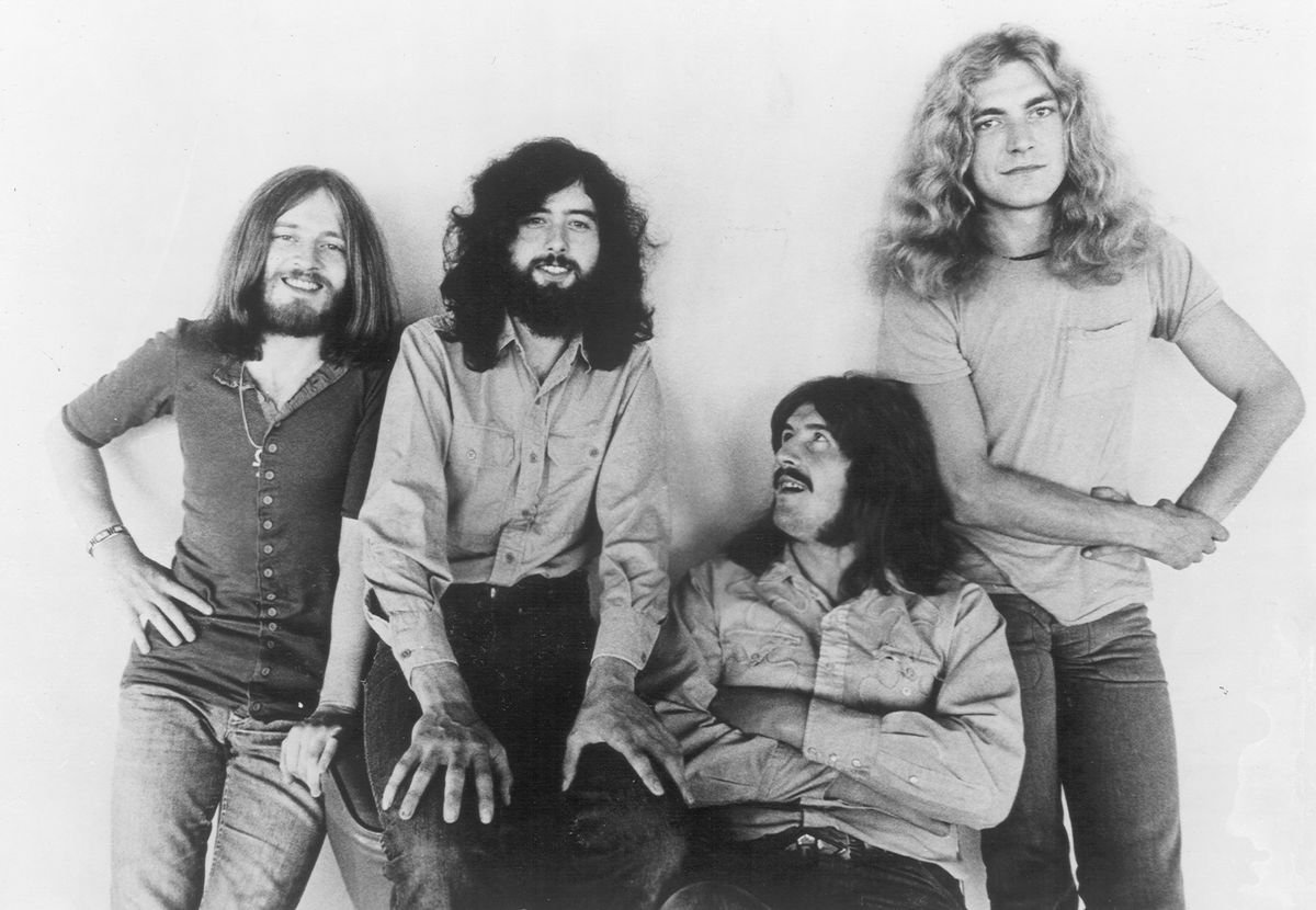Led Zeppelin in a 1971 black and white promotional photo, with bassist John Paul Jones, guitarist Jimmy Page, drummer John Bonham and singer Robert Plant posed against a plain wall