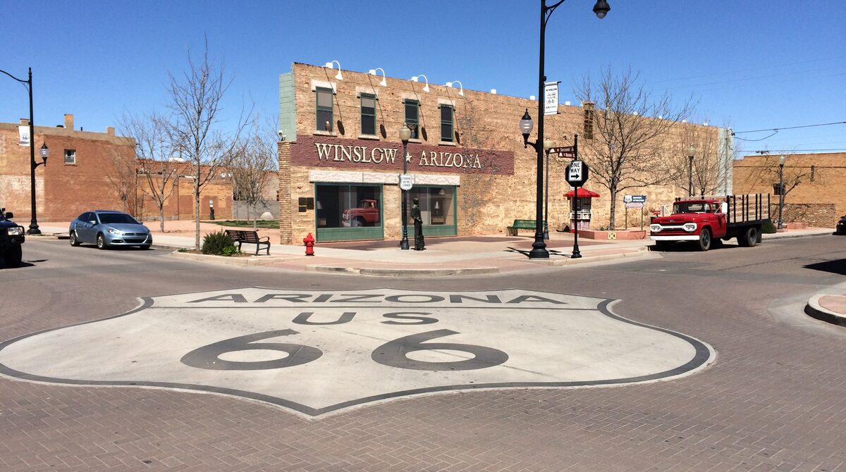 The Route 66 marker, flatbed Ford truck, and corner statue at Standin' on the Corner Park in Winslow, Arizona, built around a single line from the take it easy song